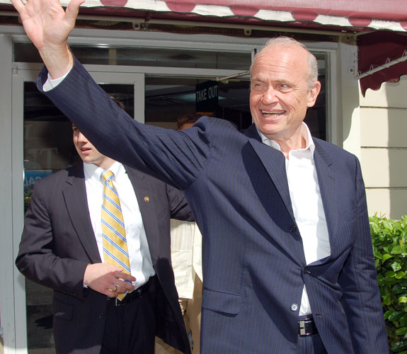 Former U.S. Senator Fred Dalton Thompson waves to supporters at a campaign rally outside of Caf&eacute; Versailles in Little Havana.