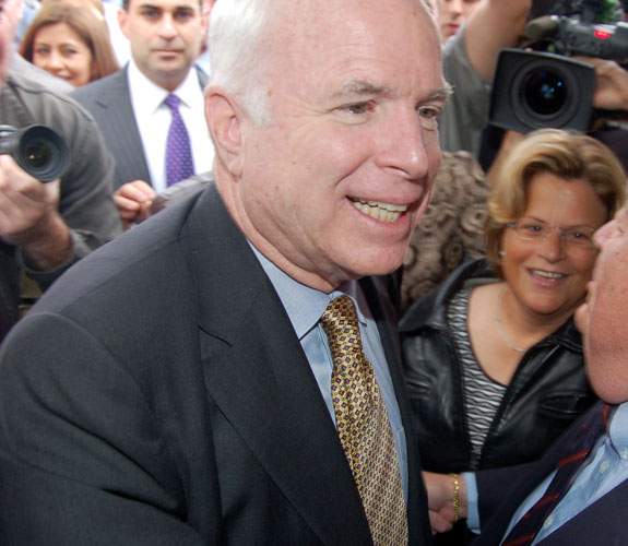 Arizona Senator John McCain navigates his way through an overflow crowd of supporters at Caf&eacute; Versailles in Little Havana.